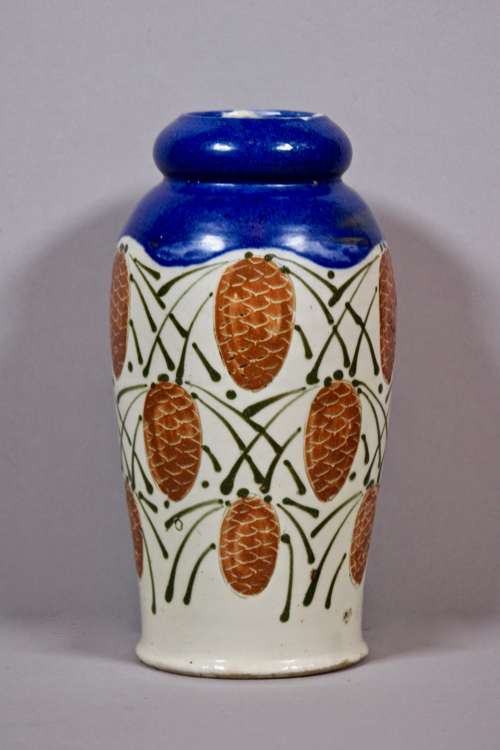 Léon Elchinger - Vase  col corolle de couleur bleu et décor de pommes de pin